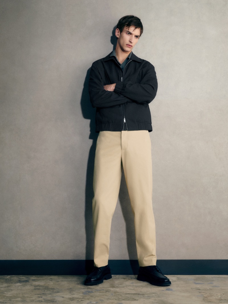 Habib Masovic wears a blouson jacket with chinos by COS.