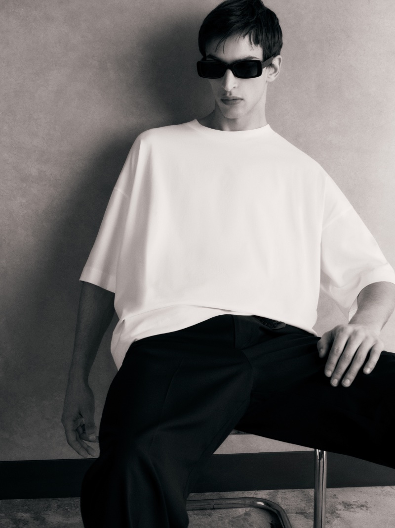 Habib Masovic embraces an edgy allure in an oversized white tee from COS.