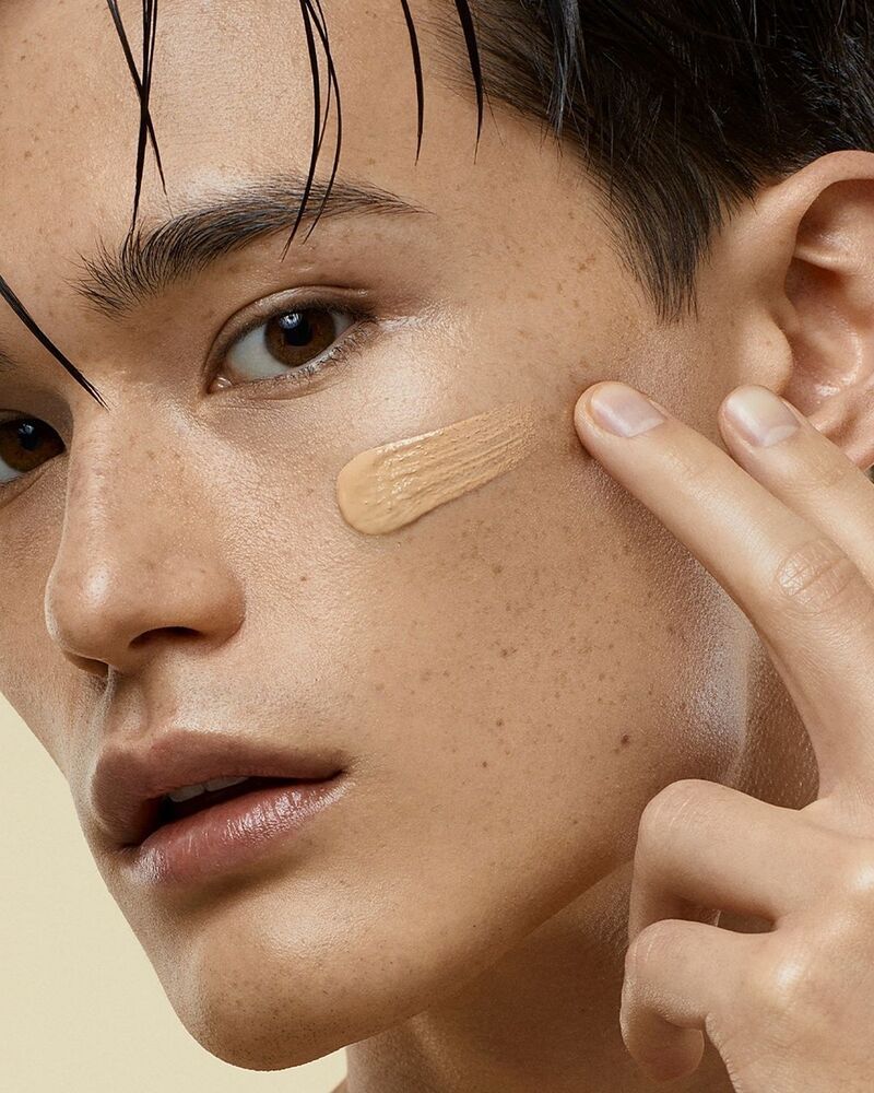 Dolce & Gabbana showcases a touch of Millennialskin On-The-Glow Tinted Moisturizer, applied by Alex Schlab.