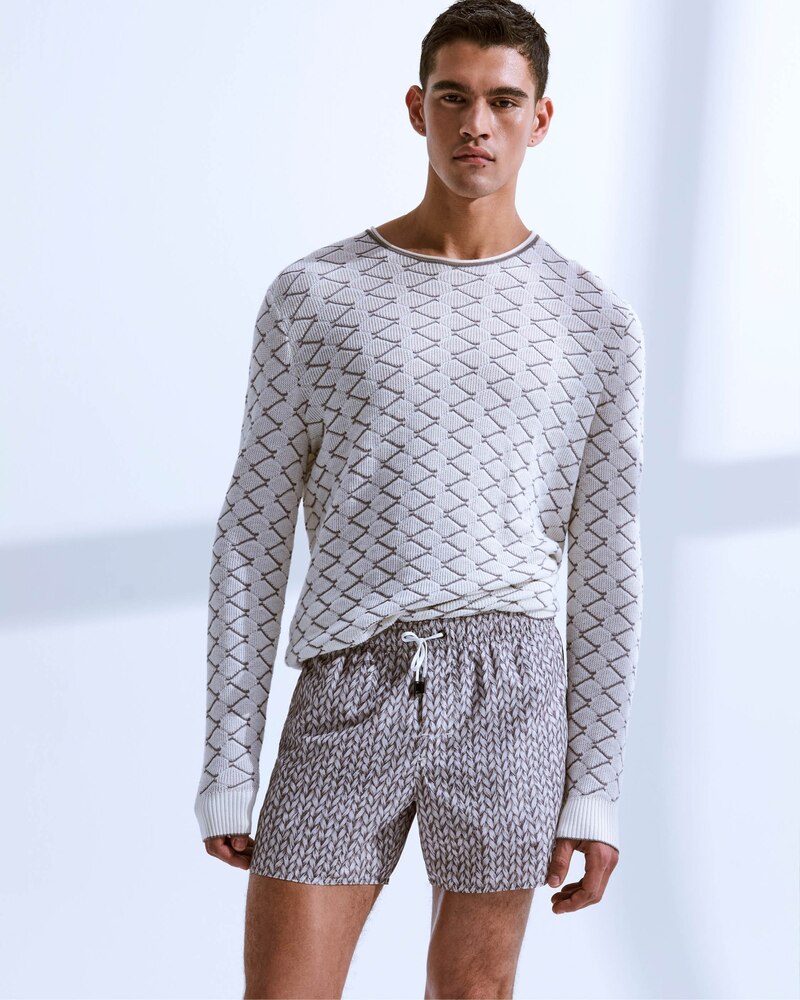 Bodhi Heeck mixes patterns in a chic but casual outfit from Giorgio Armani's spring-summer 2024 line.
