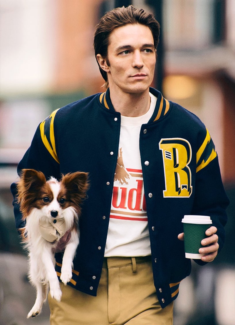 Francesco Mariottini takes a stroll in a Rhude varsity jacket and T-shirt paired with AMIRI trousers.