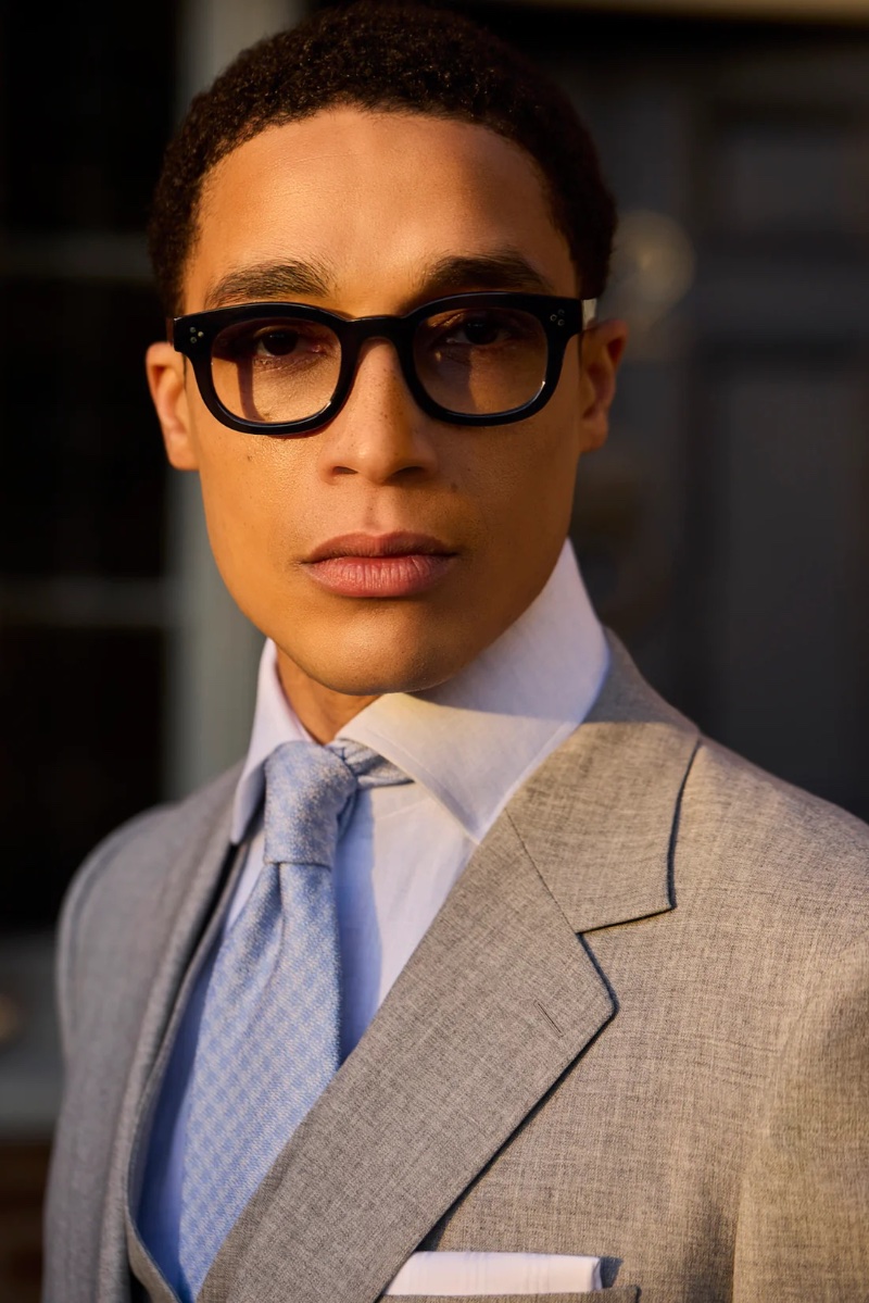 Luke Cousins presents a sharp profile in Huntsman's light grey suit from the spring-summer 2024 collection.