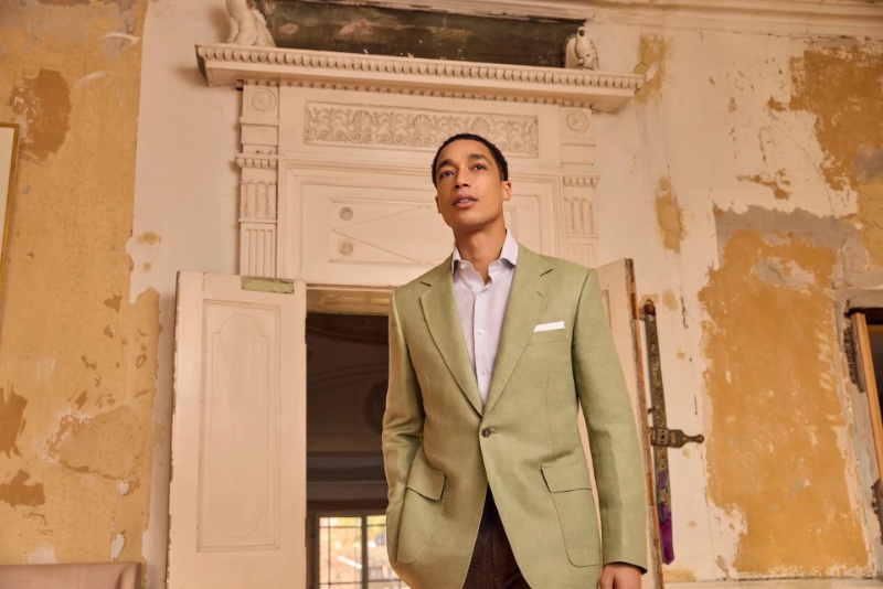 Luke Cousins commands the room in a fresh seagreen Huntsman blazer from the spring-summer 2024 collection.
