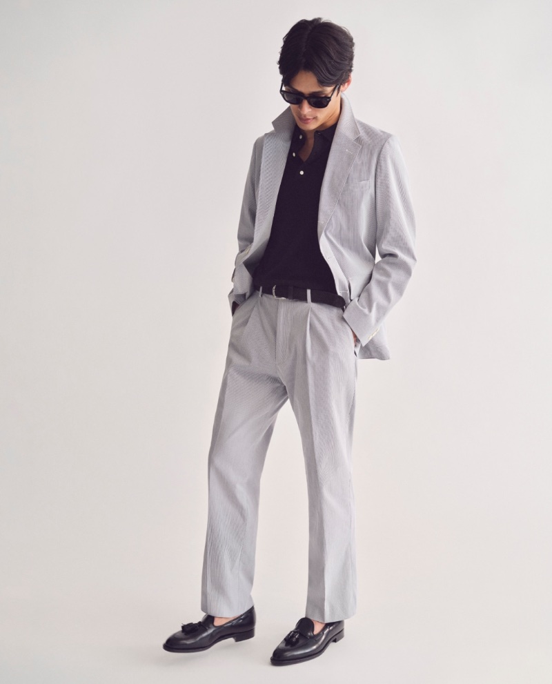 Model Taro Nakamura wears a J.Crew Kenmare Italian cotton pincord suit with a cashmere sweater polo and Alden for J.Crew cordovan tassel loafers.