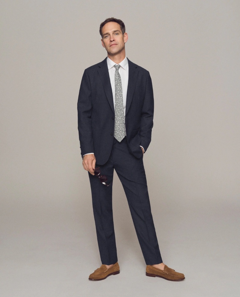 Wes Carnes dons a 
J.Crew Ludlow slim-fit English wool suit with a Bowery wrinkle-free dress shirt and Camden leather-soled suede loafers.