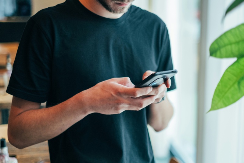 Man Black T-shirt Phone Cropped