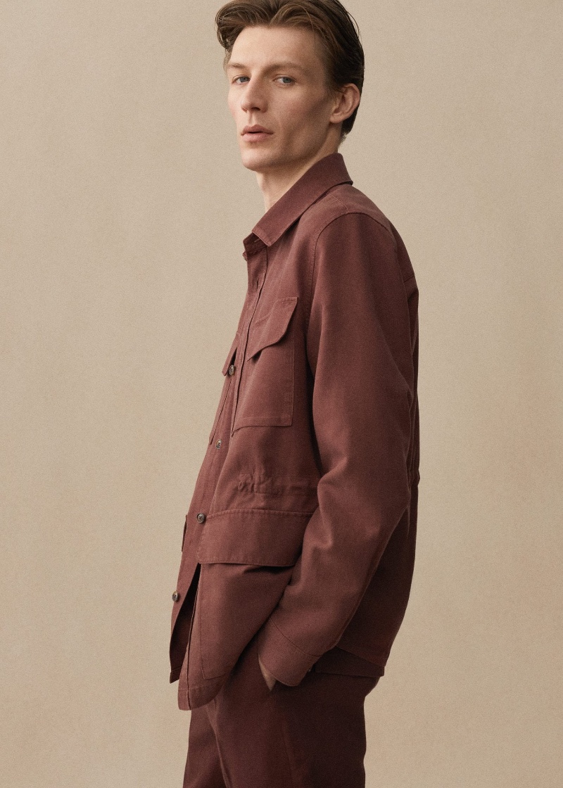 Finnlay Davis wears a maroon linen set from Mango's latest collection.