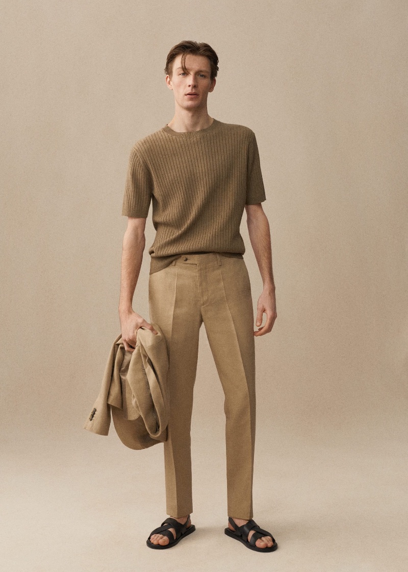 Model Finnlay Davis presents a relaxed yet refined look in a ribbed tee and linen trousers from Mango.
