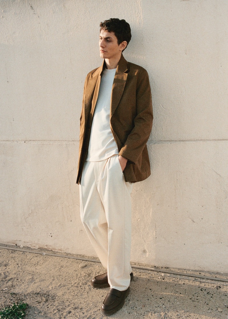 Captured in soft sunlight, Henry Kitcher showcases a Mango spring 2024 look.
