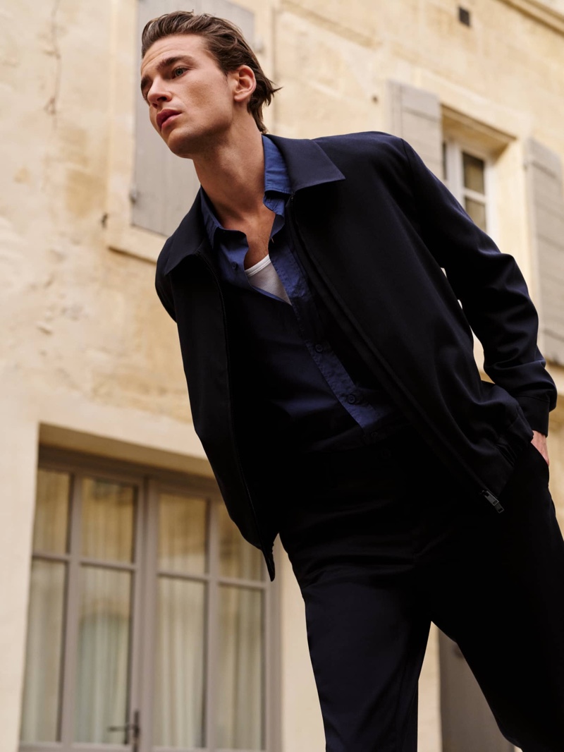 Yulef Bopp embodies sophistication in Massimo Dutti's sleek, navy ensemble.