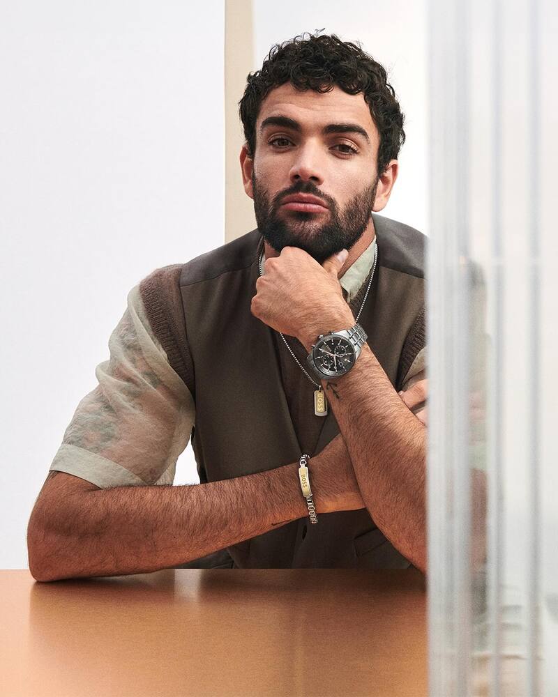 Matteo Berrettini fronts BOSS' spring-summer 2024 watch advertisement, wearing a chronograph quartz stainless steel watch with a black dial.