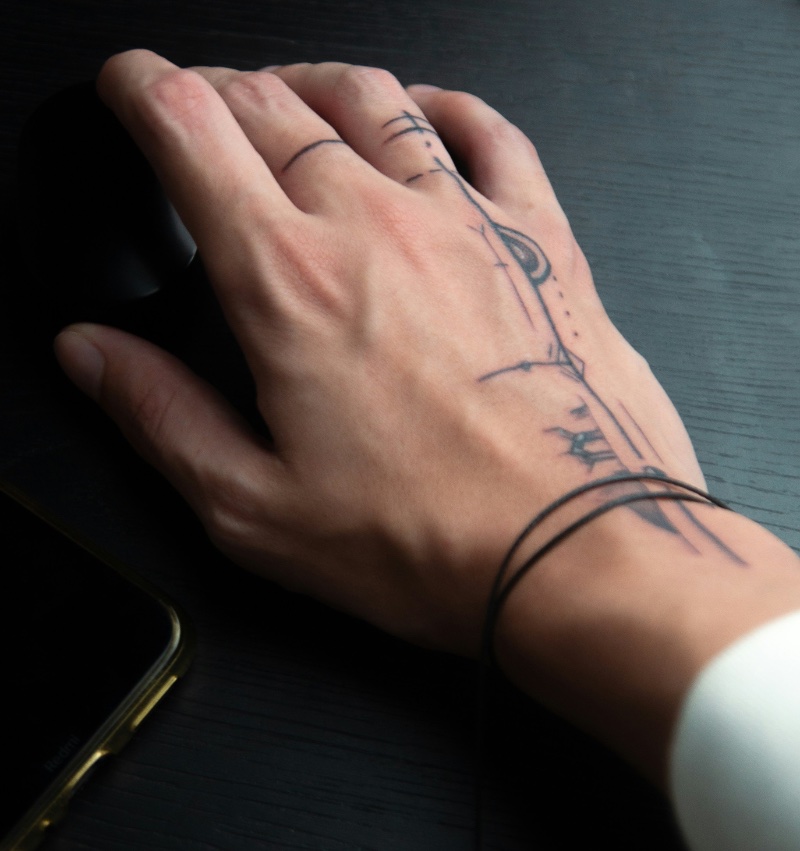 Minimalist Line Art Hand Tattoo