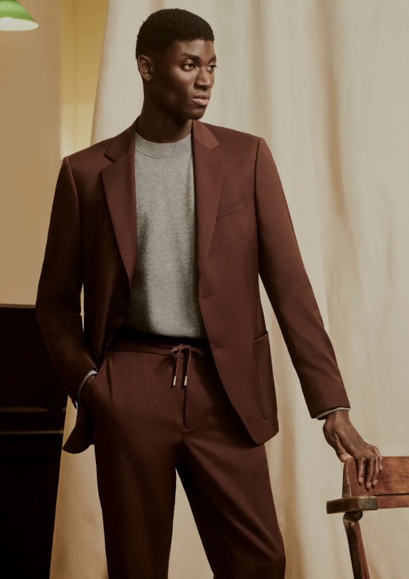 Ben Job dons an elegant suit in a rich brown from Mr P.'s spring 2024 collection.