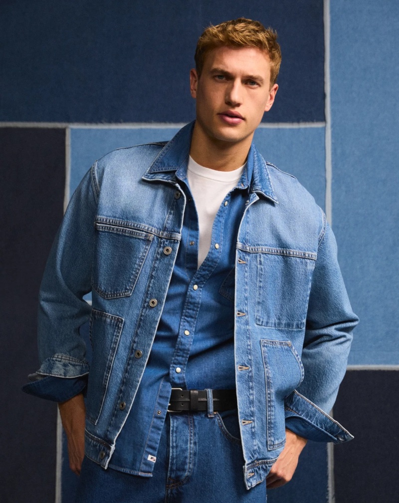 Great denim comes in threes with Paul François wearing a denim jacket, shirt, and jeans by Pepe Jeans.