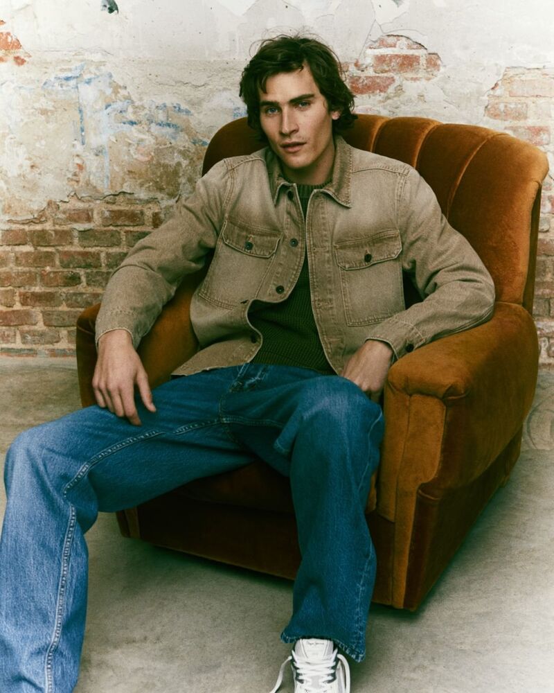 Liam Kelly models distressed denim from Pepe Jeans. 