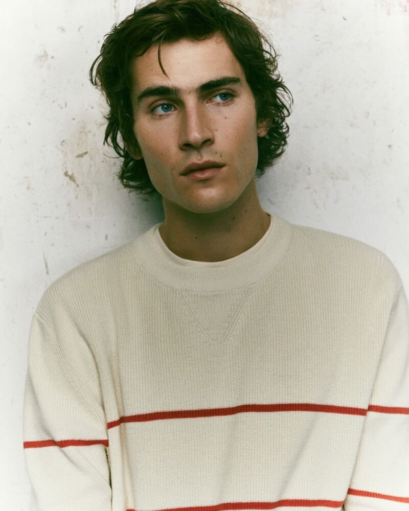 Liam Kelly dons a striped sweater, embodying the effortless style of Pepe Jeans.