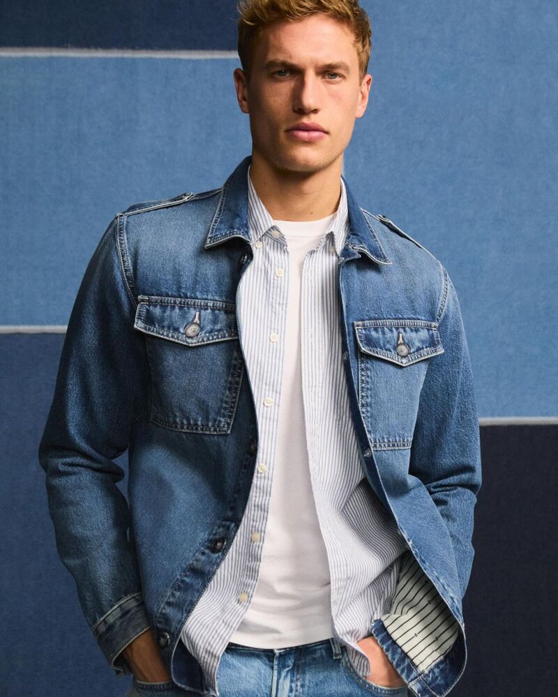 Paul François sports a classic denim jacket over a striped shirt from Pepe Jeans.