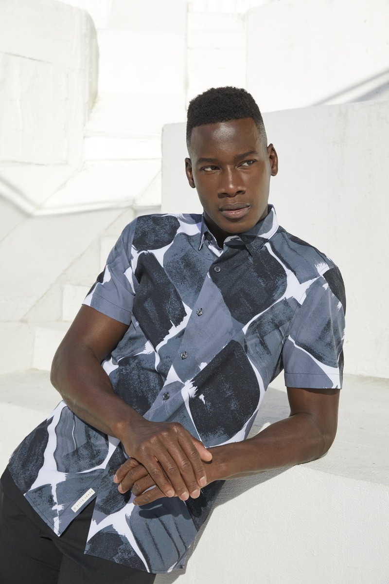 David Agbodji showcases a bold print shirt by Perry Ellis.