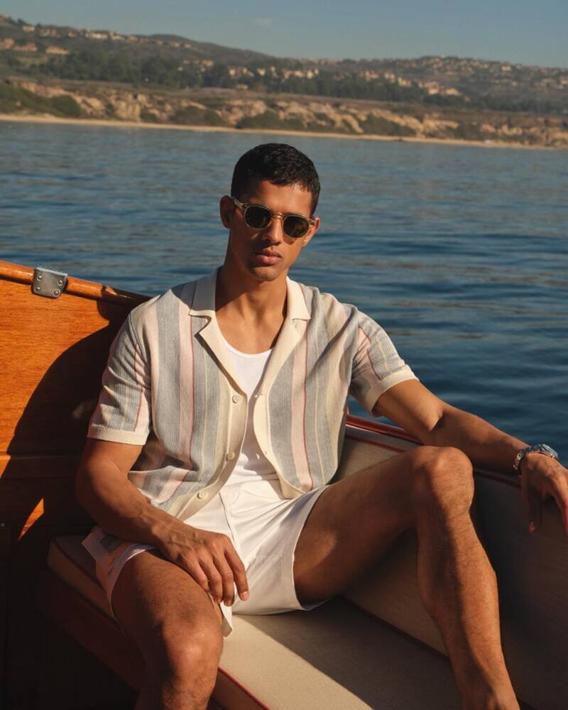 Enjoying a day on the water, Jonas Barros models a cotton-silk stripe polo. 