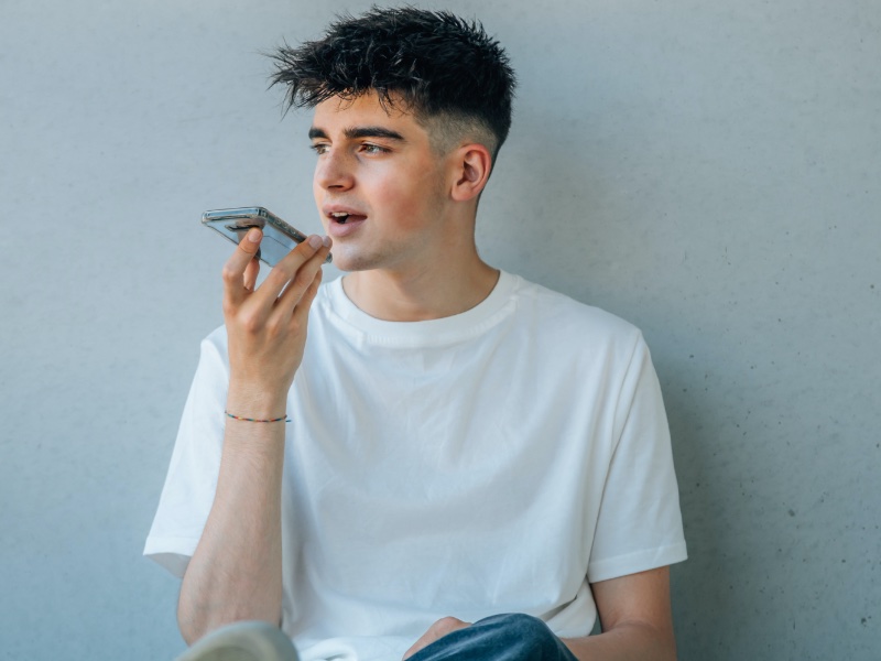 Young Man Talking Into Phone