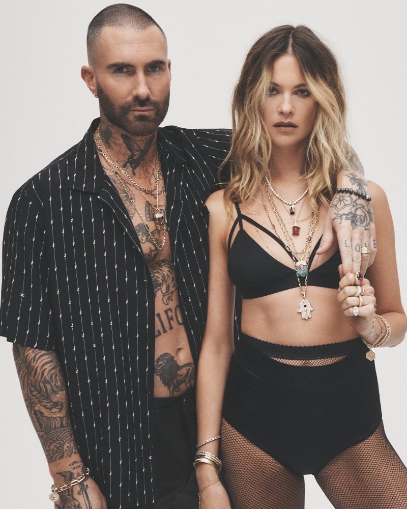 Adam Levine and his wife, Behati Prinsloo, exude edgy glamour in Jacquie Aiche's Rebel Heart campaign, adorned with layered necklaces, bracelets, and rings.