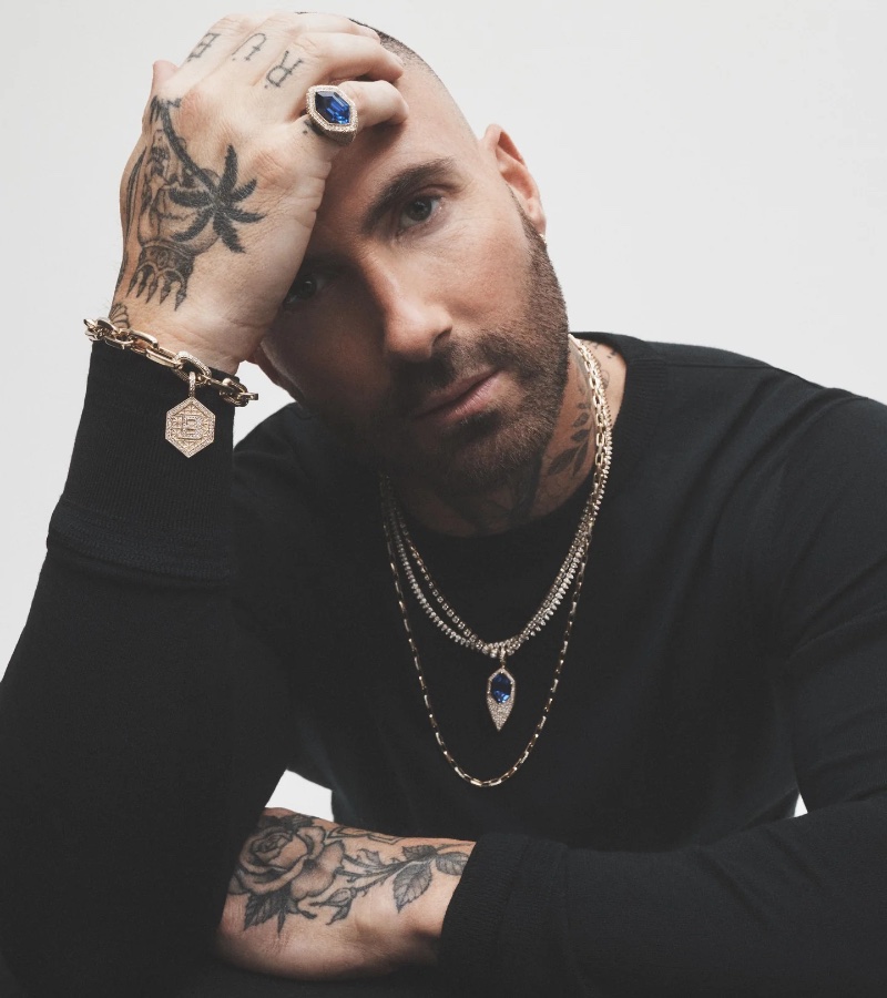 Adam Levine stars in the Jacquie Aiche Rebel Heart campaign, his tattooed hands accentuated by bold jewelry.