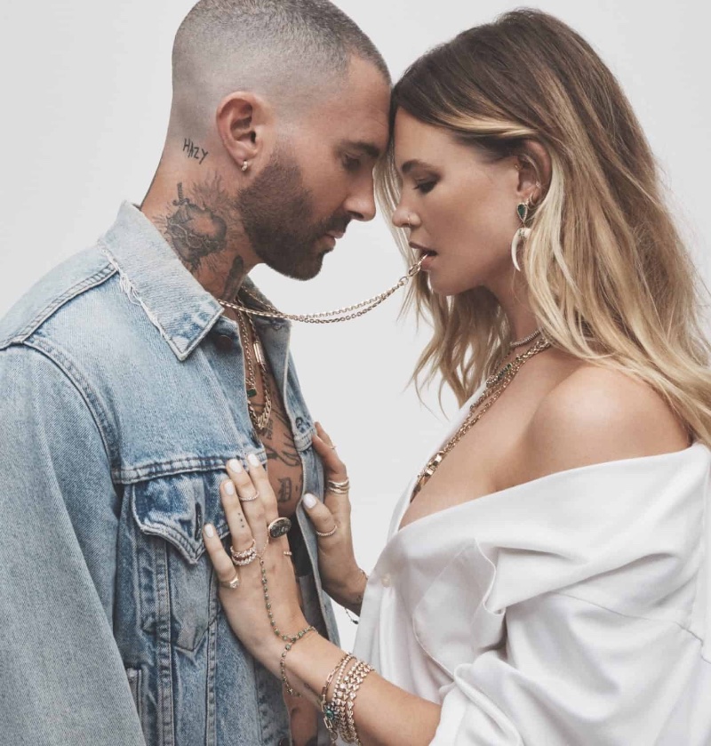 The Jacquie Aiche advertisement captures a tender exchange between Adam Levine and Behati Prinsloo, wearing the brand's delicate jewelry.