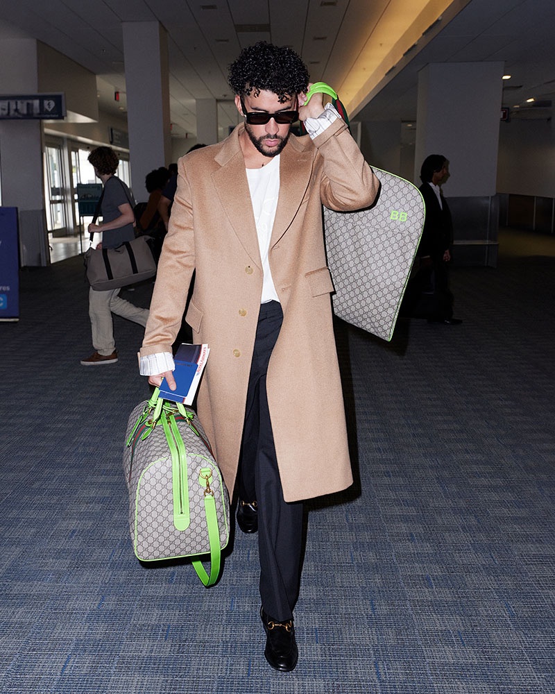 Gucci Valigeria and Bad Bunny set the tone for travel luxury, featuring the iconic duffle with an fluorescent green trim.