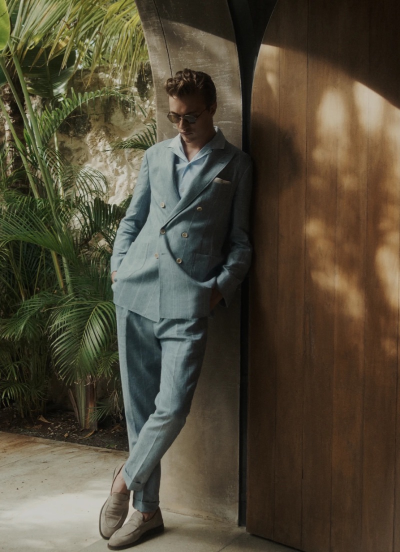Lucky Blue Smith poses in a tailored double-breasted suit by Brunello Cucinelli. 