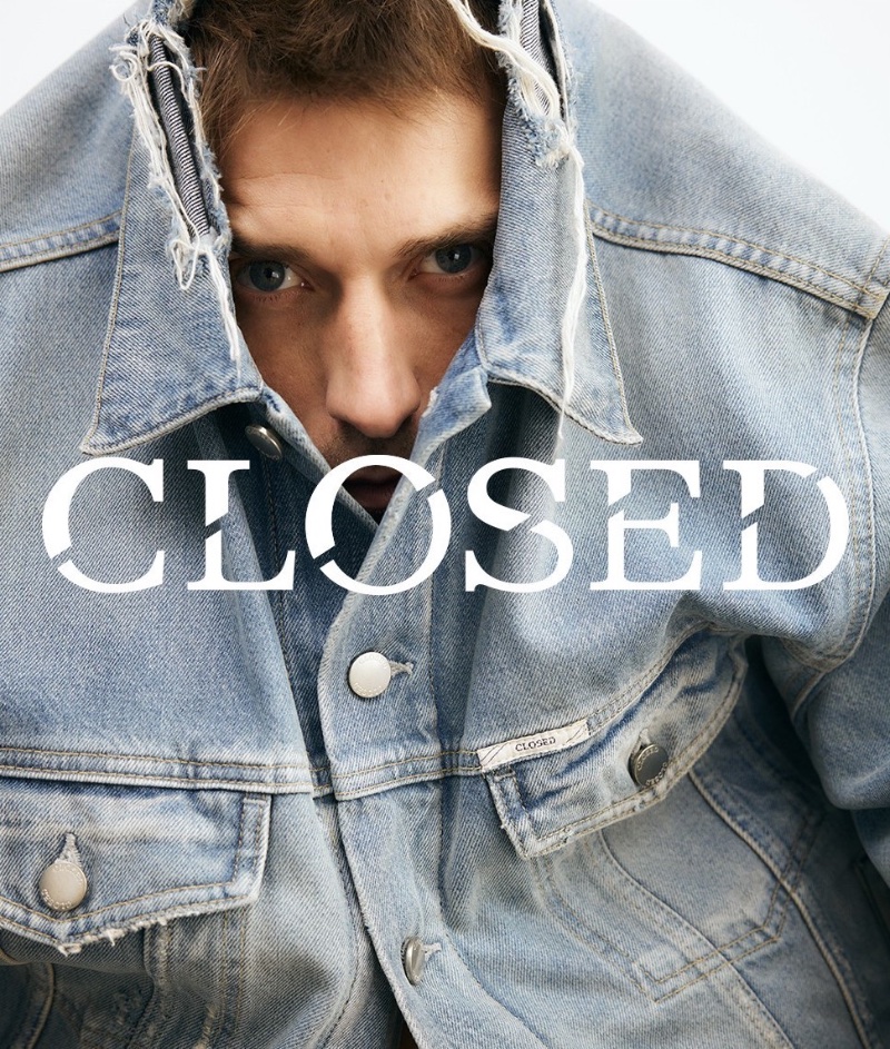Clément Chabernaud peers through a jean jacket, fronting Closed's summer 2024 denim campaign.