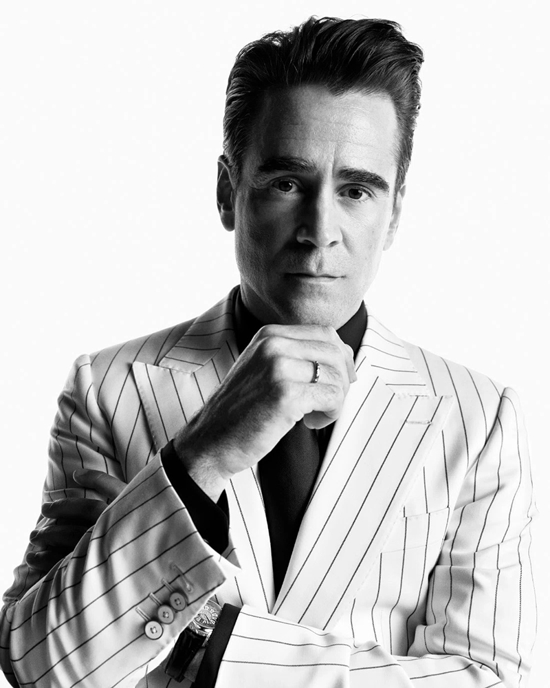 Sporting a pinstripe suit, Colin Farrell fronts the Dolce & Gabbana Sartoria ad.