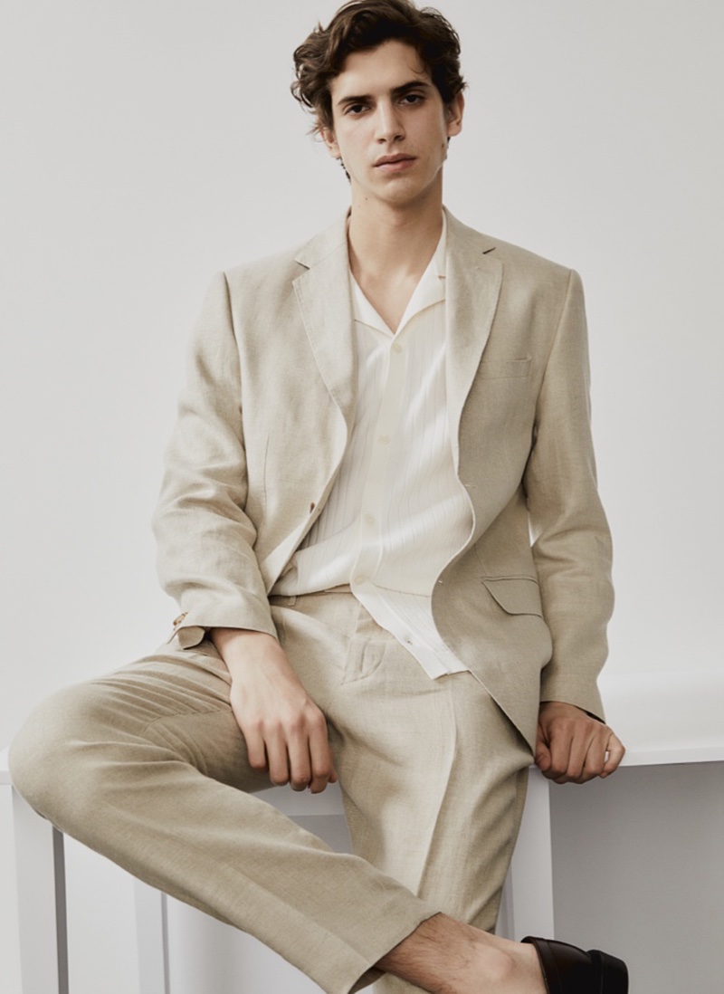 Hedi Ben Tekaya models a linen suit from H&M's spring 2024 collection. 