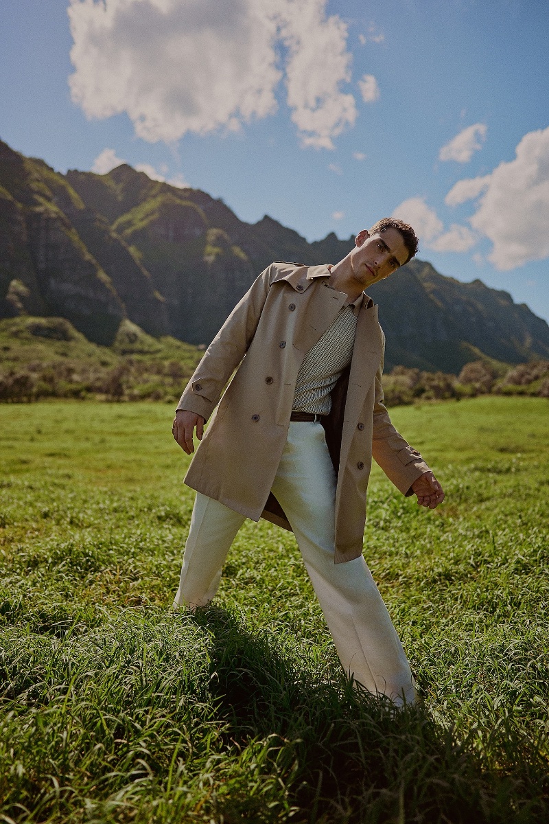 Kane Roberts cuts a dashing figure in a classic trench coat for Indochino's spring-summer 2024 campaign.