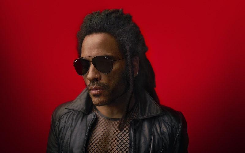 SingerLenny Kravitz exudes cool in Ray-Ban Reverse sunglasses for a striking campaign visual.