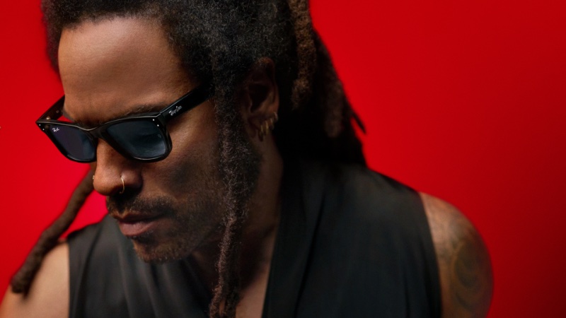 Lenny Kravitz, in profile, brings a soulful intensity to the Ray-Ban Reverse campaign with his bold black sunglasses. 