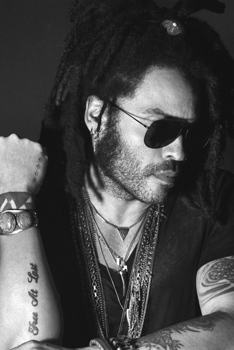 In a black t-shirt adorned with chains, Lenny Kravitz lends his iconic style to the Yves Saint Laurent Y Elixir campaign.