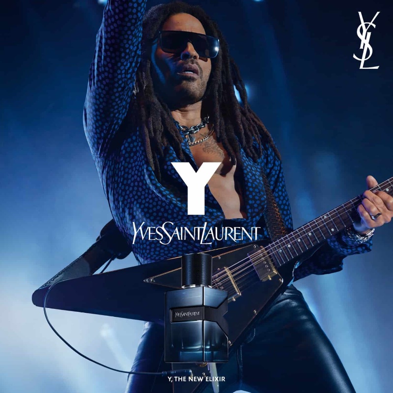 In a bold campaign image for Yves Saint Laurent's Y Elixir, Lenny Kravitz strikes a pose adorned in a polka dot shirt and leather pants.