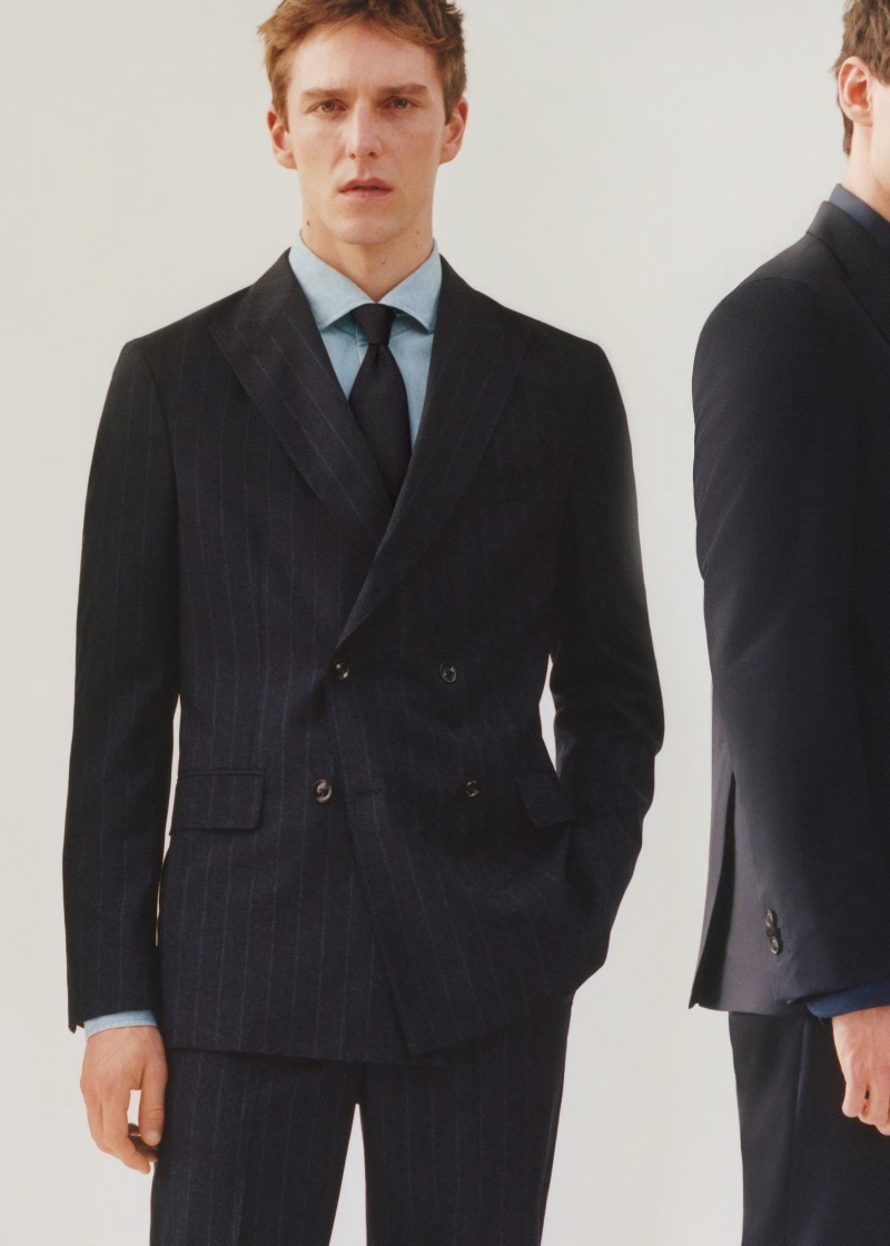 Quentin Demeester cleans up in a sharp, pinstripe double-breasted suit from the Mango Designed by Boglioli collection.