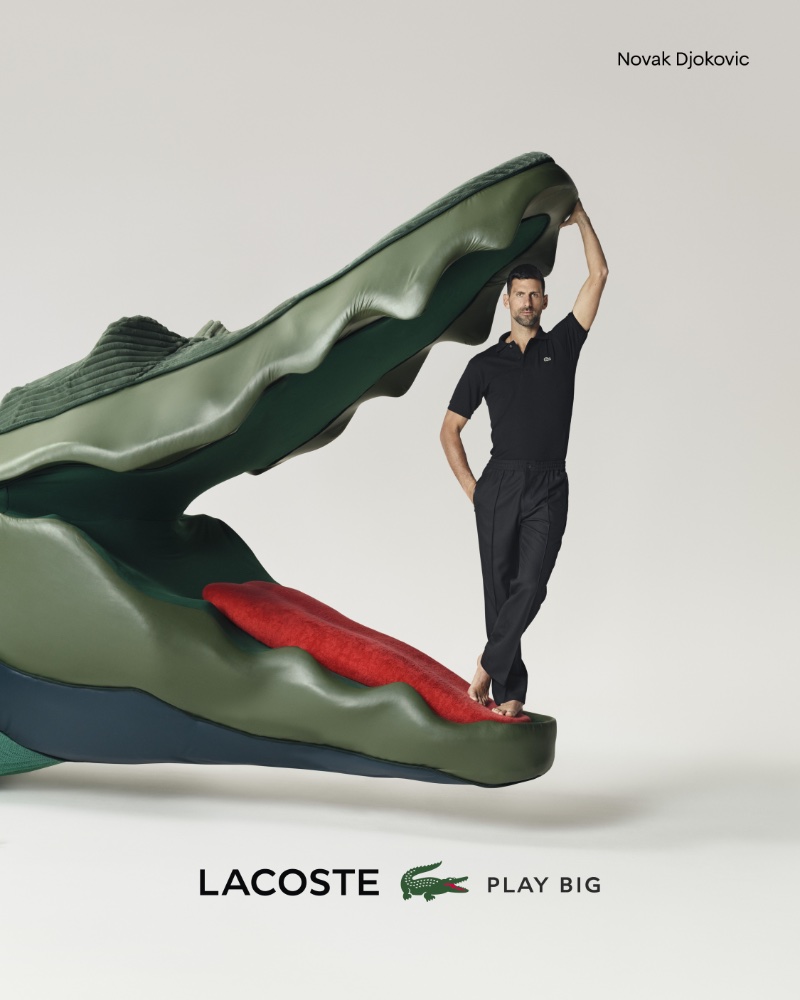An elegant figure in a black polo and pants, Novak Djokovic stars in the Lacoste Play Big ad. 