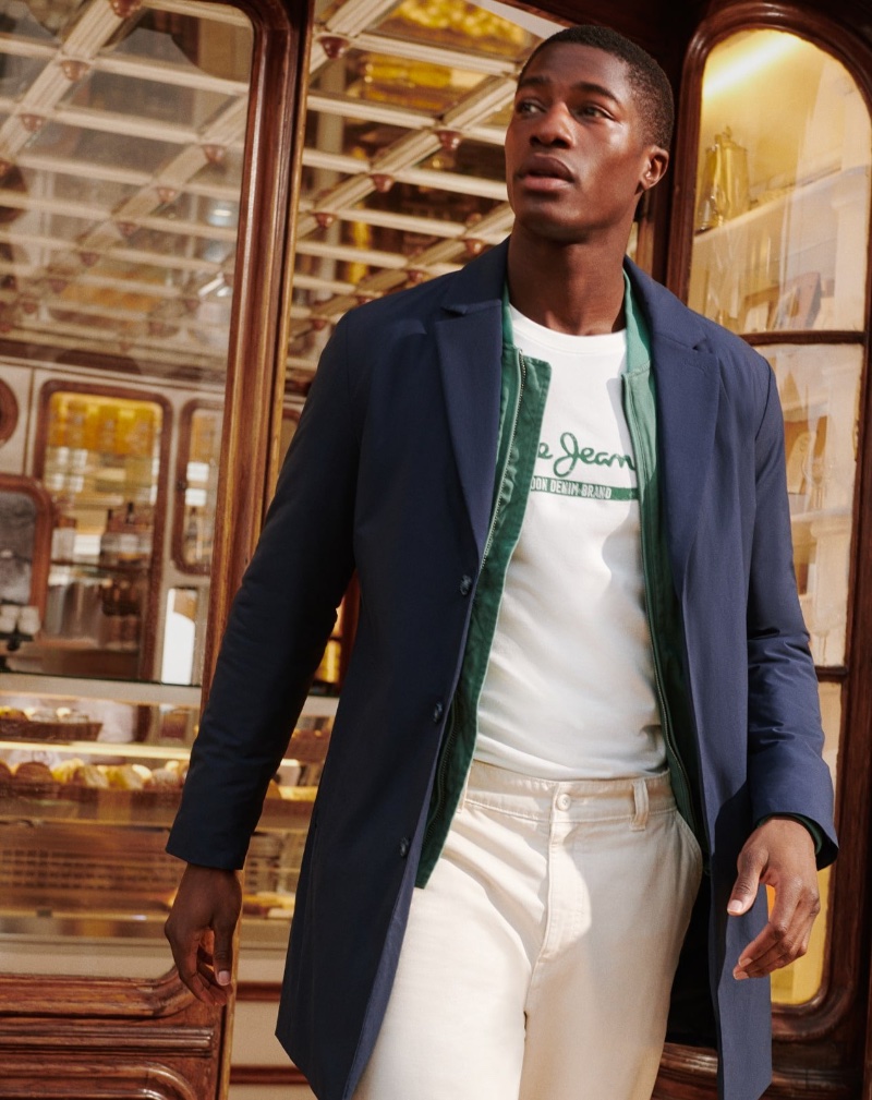 Mukasa Kakonge exudes effortless style in a tailored coat for Pepe Jeans' spring 2024 ad.