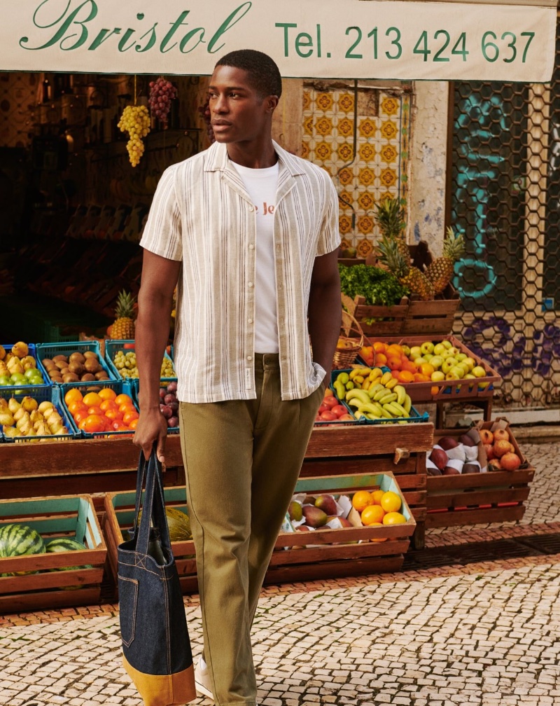 Mukasa Kakonge brings a fresh vibe to the Pepe Jeans spring 2024 campaign with a market stroll, tote in hand.