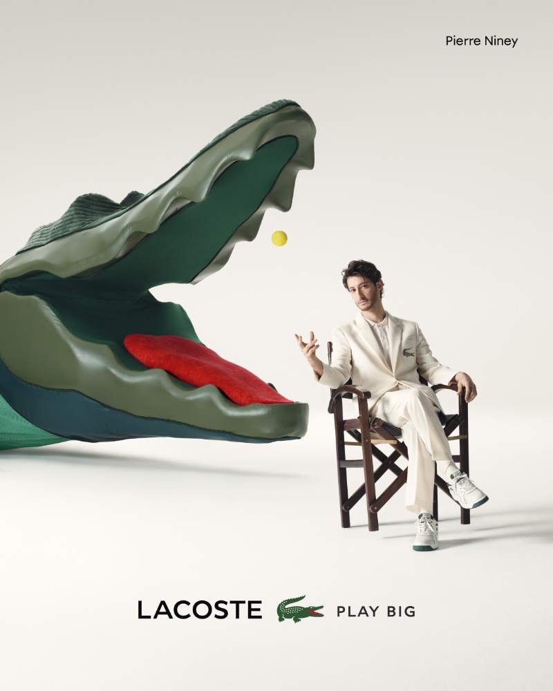 A chic vision in an off-white suit, Pierre Niney fronts the Lacoste Play Big advertisement. 