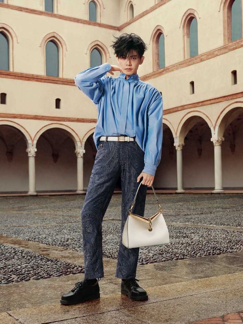 Ren Jialun dons a blue shirt and paisley trousers for Etro's spring-summer 2024 campaign.