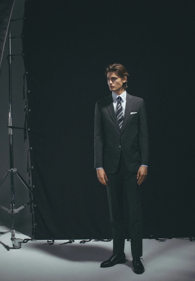 Standing tall, Mark Vanderloo Jr. wears Scalpers' classic dark charcoal suit. 