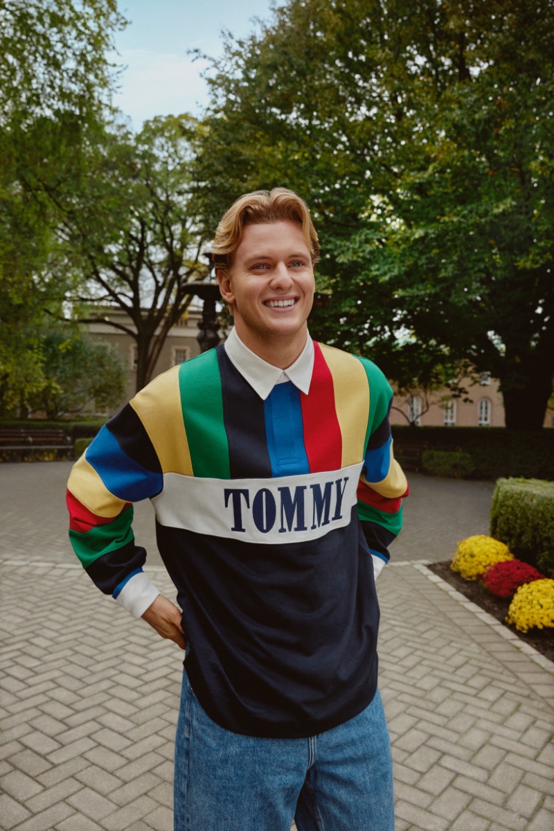 Mick Schumacher beams in a vibrant Tommy Jeans rugby shirt for the International Games campaign.