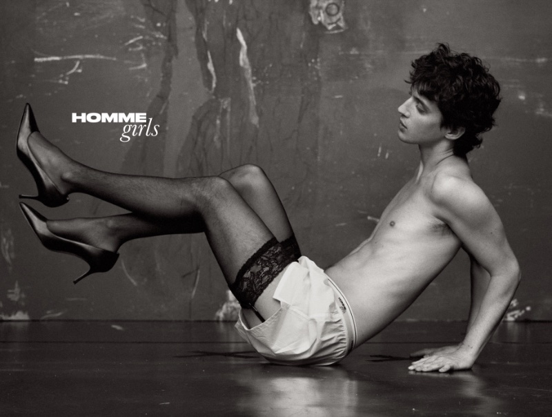 Appearing in a black-and-white image, Troye Sivan dons HommeGirls boxers with Calzedonia stockings, an Agent Provocateur garter belt, and vintage Manolo Blahnik pumps.