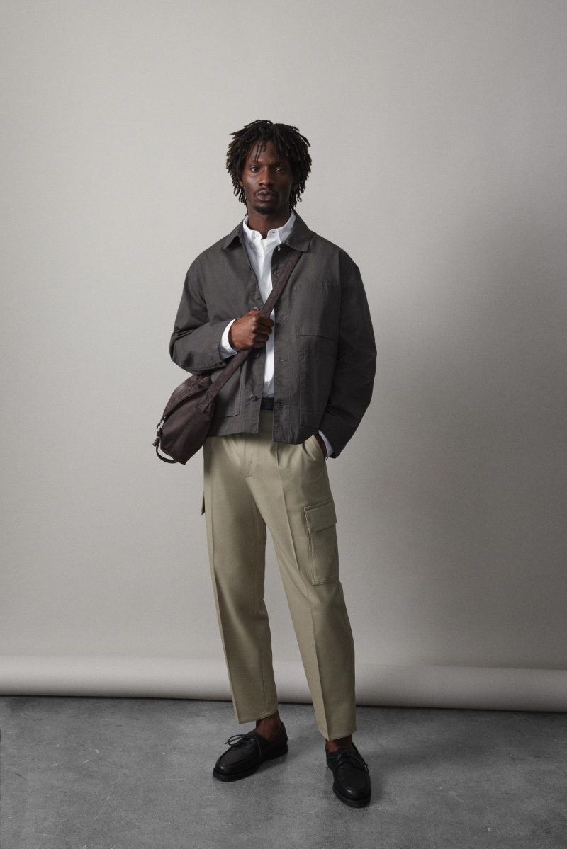 Adonis Bosso cuts a dapper figure in Zara's spring 2024 collection, sporting a shirt jacket with cargo trousers.