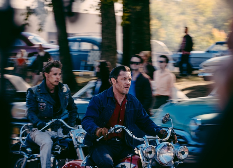 In The Bikeriders, Austin Butler as Benny and Tom Hardy as Johnny blaze down the road, dressed in biker denim and leather.