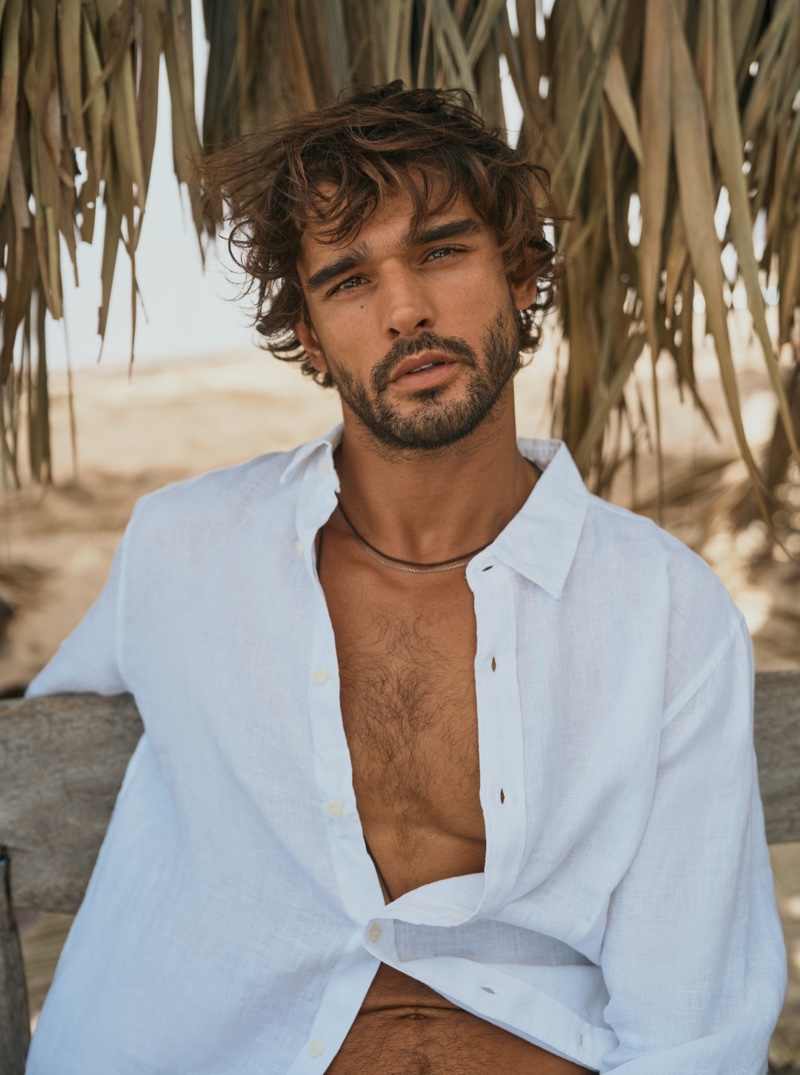Brazilian model Marlon Teixeira stars in Banana Republic's summer 2024 campaign wearing a white linen shirt. 