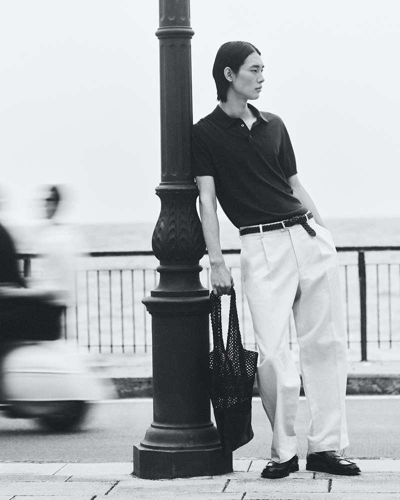 Taemin Park wears a knit silk polo with pleated linen-blend pants from COS' summer 2024 collection. 